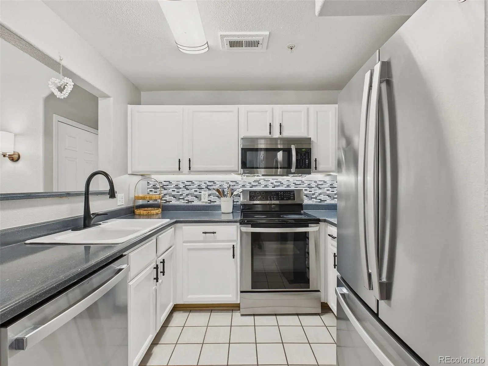14296 E Whitaker Place #111 Aurora CO 80015 MLS #REC2562285 05162026042906 1600 8