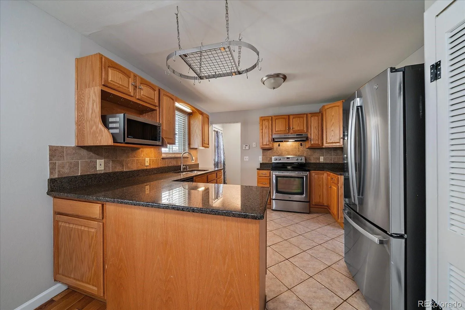 8282 Navajo Street Denver CO 80221 | MLS #REC3248313 08262026004503 1600 13