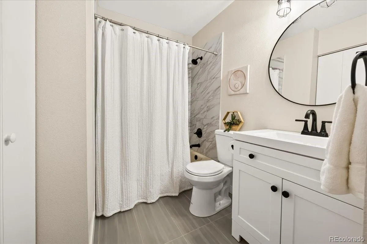 8335 Fairmount Drive #7-205 Denver CO 80247 | MLS #REC5998048 08052026001707 1200 17