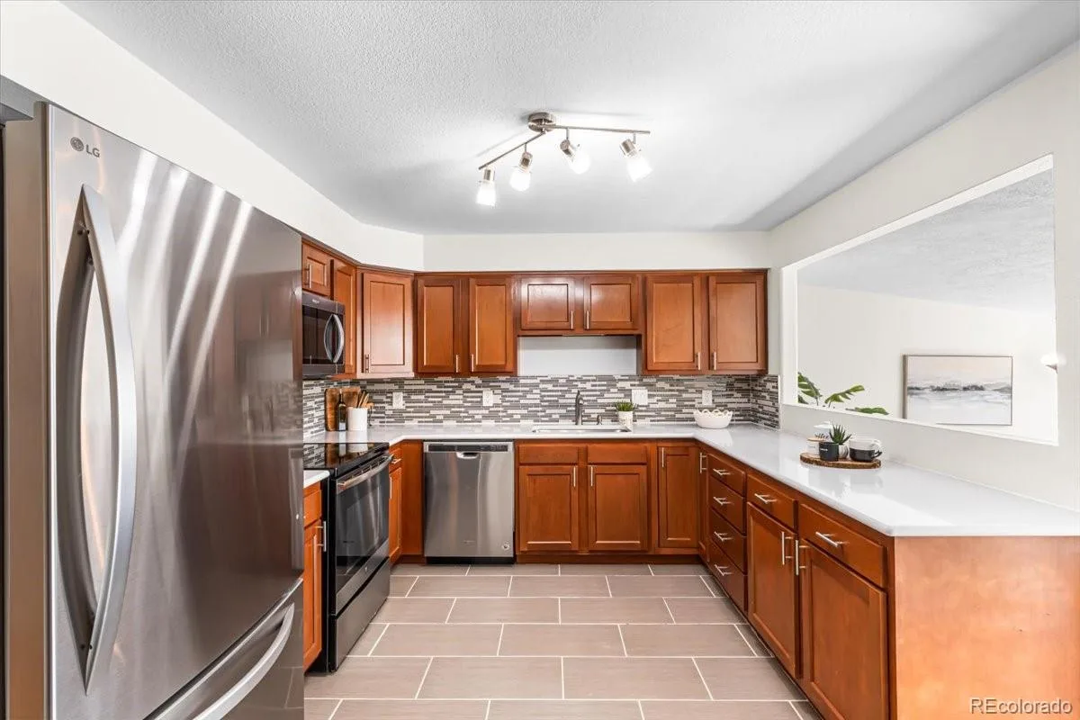 6764 Newland Street Arvada CO 80003 | MLS #REC7217485 08102026174623 1200 7