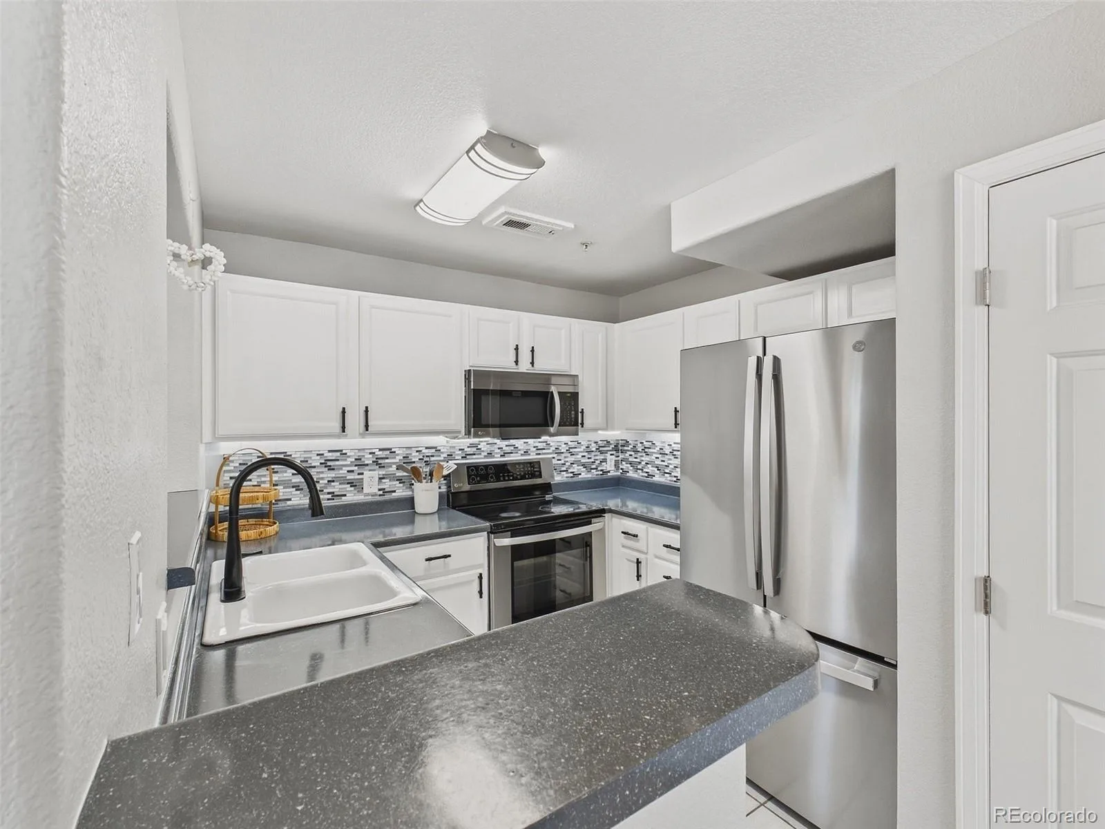 14296 E Whitaker Place #111 Aurora CO 80015 | MLS #REC8646010 08132026223801 1600 11