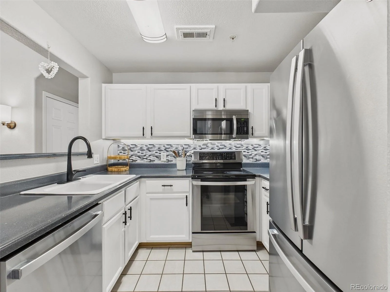 14296 E Whitaker Place #111 Aurora CO 80015 | MLS #REC8646010 08132026223801 1600 2
